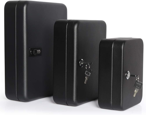 Black metal wall mount key storage box with embossed code, locking key, and side handle against white background.