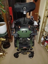Quantum Q6 Edge Power/Motorized Green Wheelchair w/ a lot of Bells  Whistles