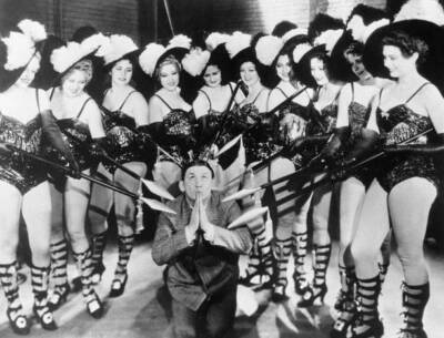 Dancers spears hold a kneeling man as part a cabaret act 1933 New - 1933 Photo