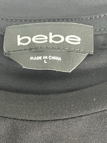 Prenda para el torso bebe para mujer adolescente talla L con logotipo negro en púrpura rosa azul transparente gemas sintéticas - Imagen 3 de 10
