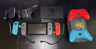 Nintendo Switch Gray Console w/ Red/Blue grips, Dock, Charger, case.