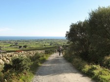 Photo A2 Walkers descending towards Carrick Little after a day in the hi c2016