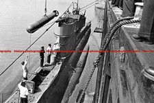 F009857 Submarine crew in training with torpedo WW2