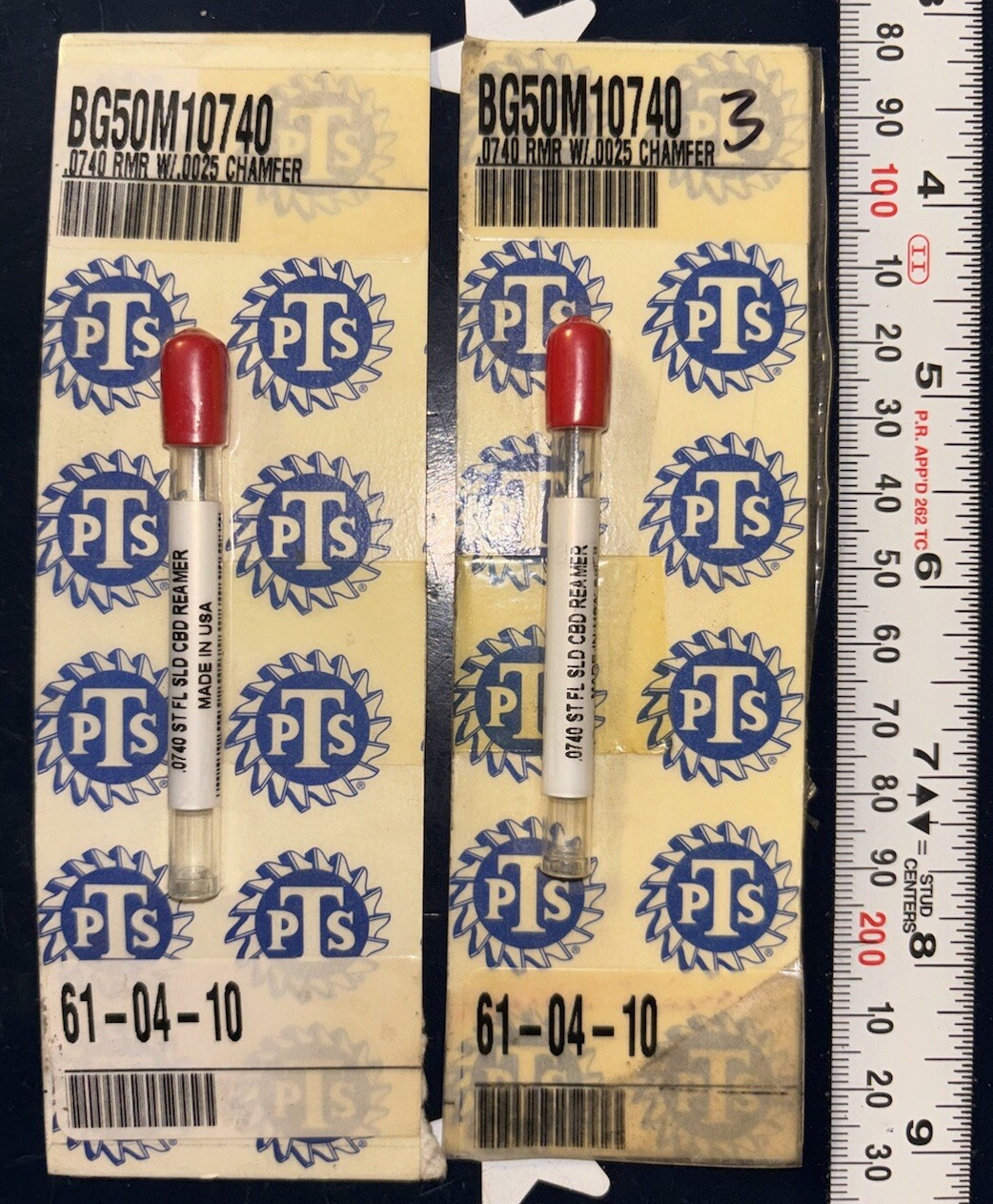 Two gold 2 X PTS .0740 solid carbide chucking reamers with red and white labels and blue star and oval PTS logo.