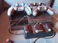 PS4 + 14 jeux + 4 manettes