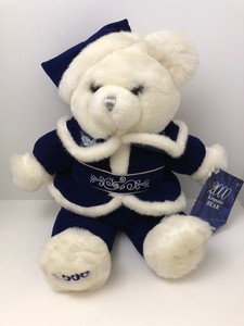 christmas teddy bear with year on foot