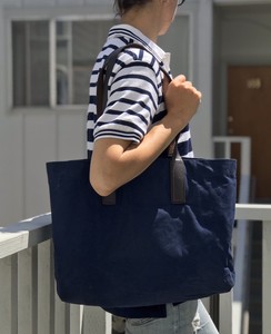 blue bag brown straps