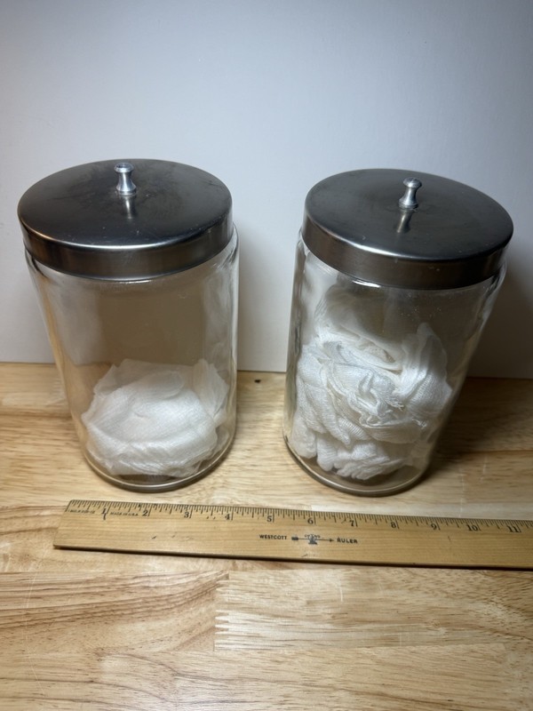 Two unmarked medical apothecary glass jars with stainless lids Grafco
