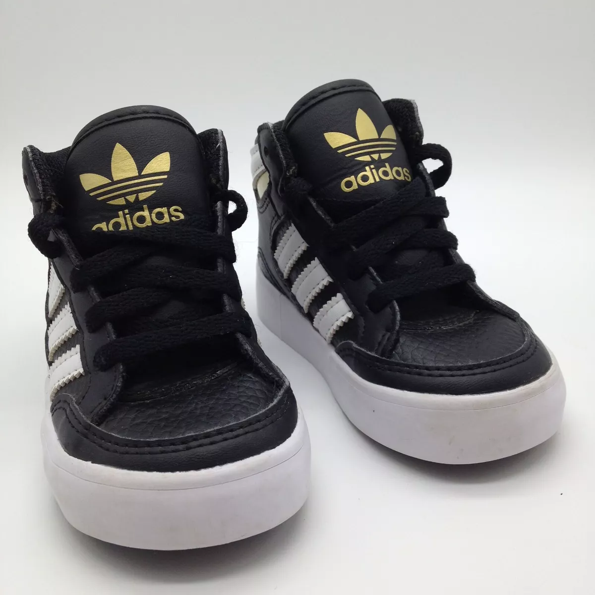 black gold adidas high tops