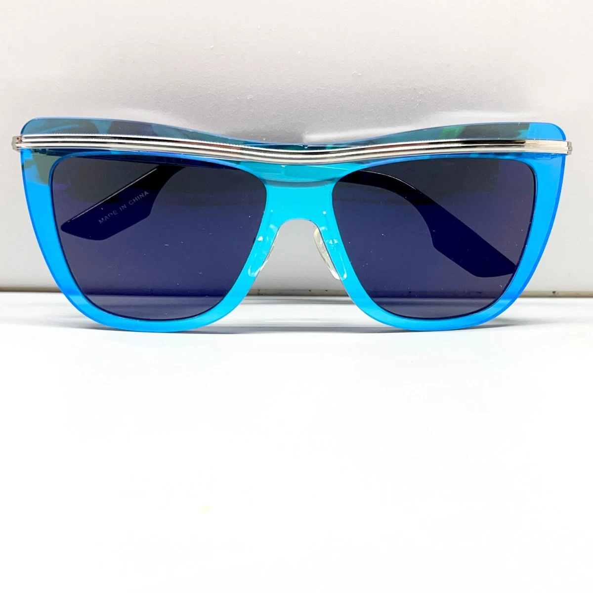 Alexandra McQueen transparent blue sunglasses Buy Alexander McQueen Blue (010) Glasses Online - Sunglasses.ie main image 2