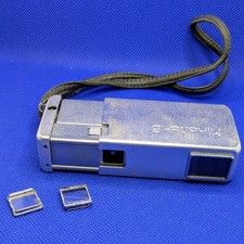   MINOLTA 16 MODEL SUBMINIATURE CAMERA W. STRAP