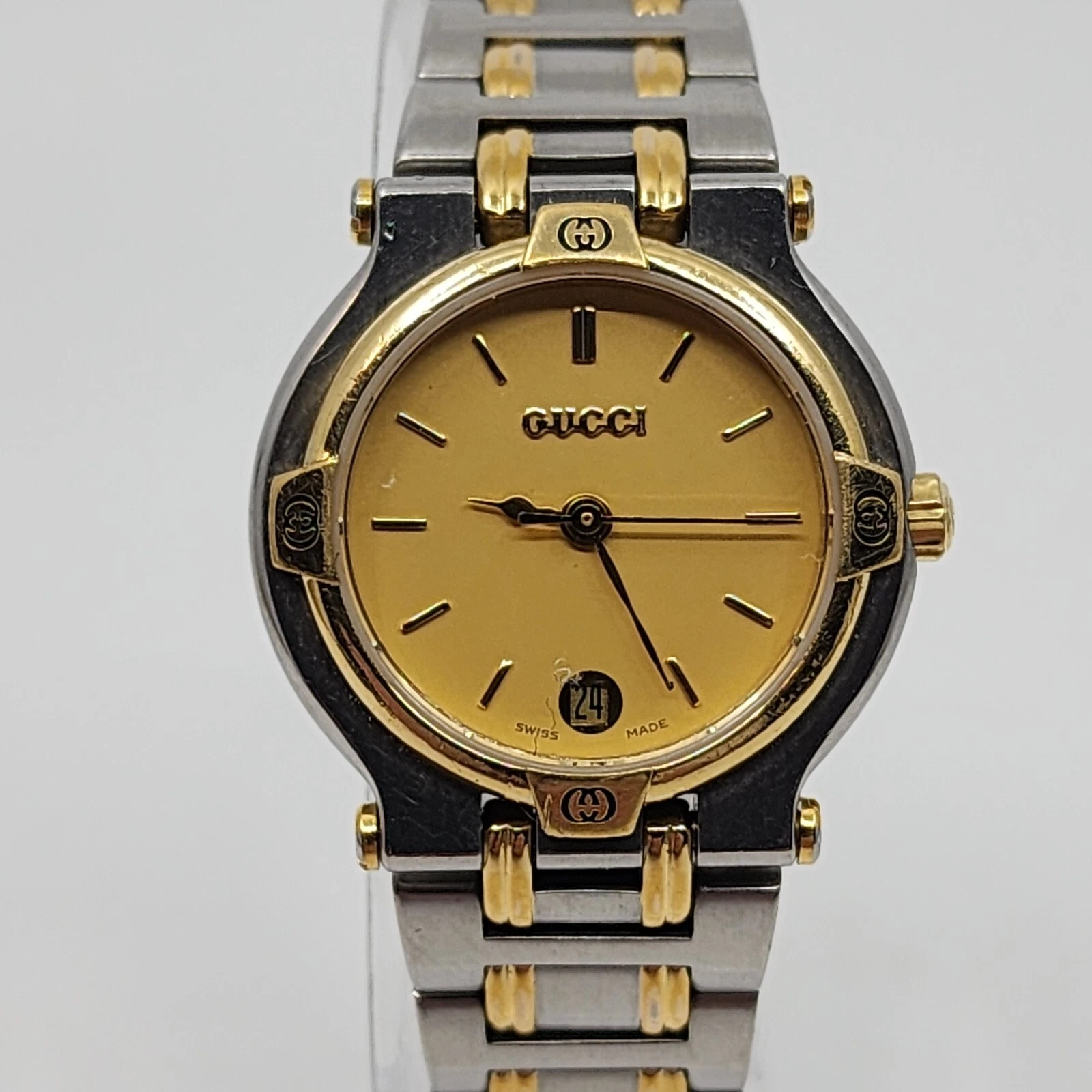 Montre femme vintage Gucci 9000L deux tons acier 25 mm cadran doré quartz