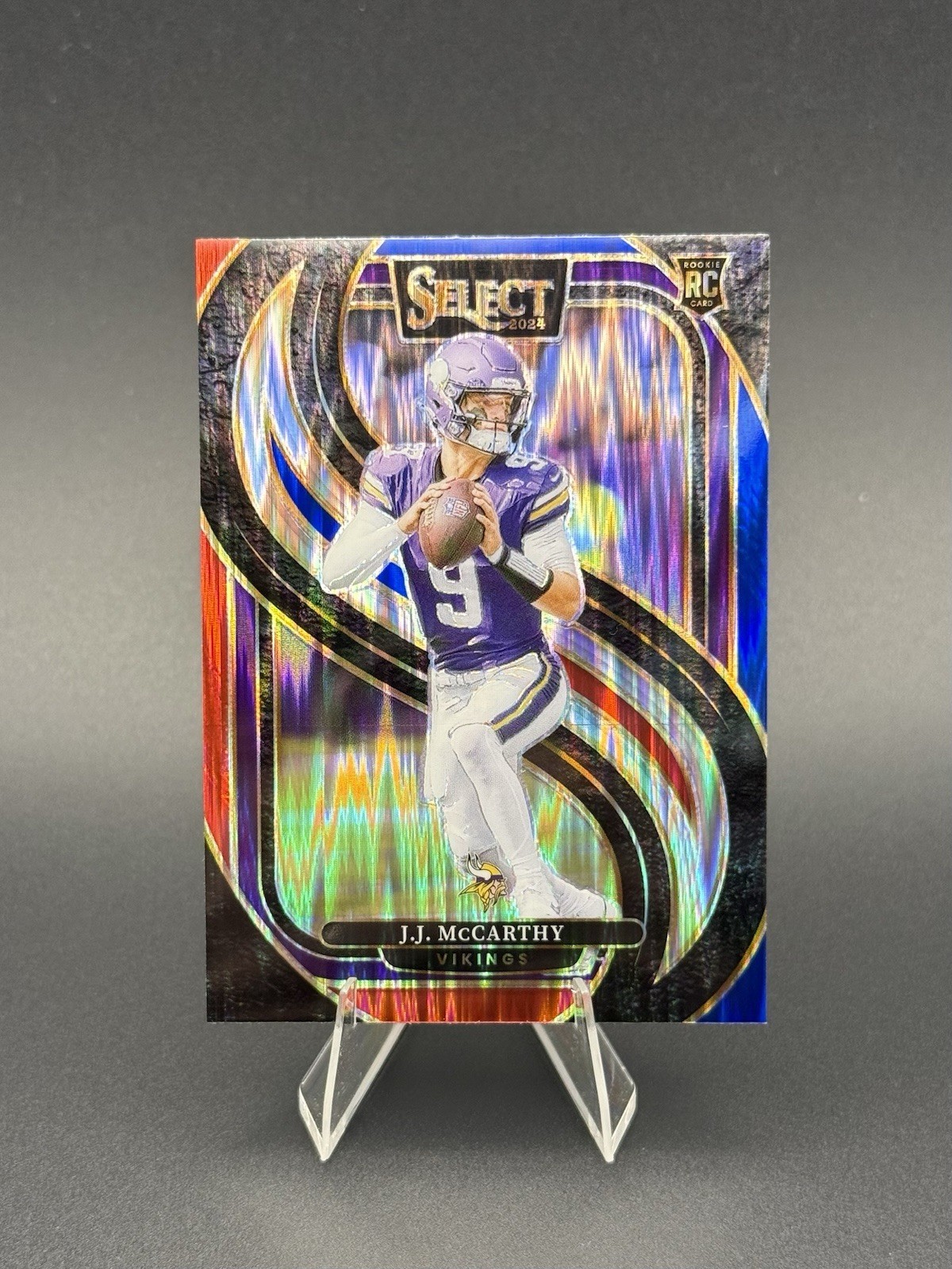 2024 Panini Select - Premier Level J.J. McCarthy #134 Red & Blue Shock Prizm RC