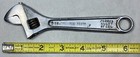 Chrome 6" adjustable crescent wrench with black handle, marked “706 PROTO FORGED ALLOY STEEL,” on white surface.