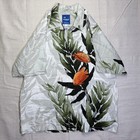 Light gray vintage Wyland AFTCO Bluewater men’s Hawaiian shirt with orange fish and green leaf print.