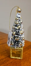 NWT MELROSE CHRISTMAS ORNAMENT SNOW PINE TREE ON GOLD GIFT BOX 5.5"