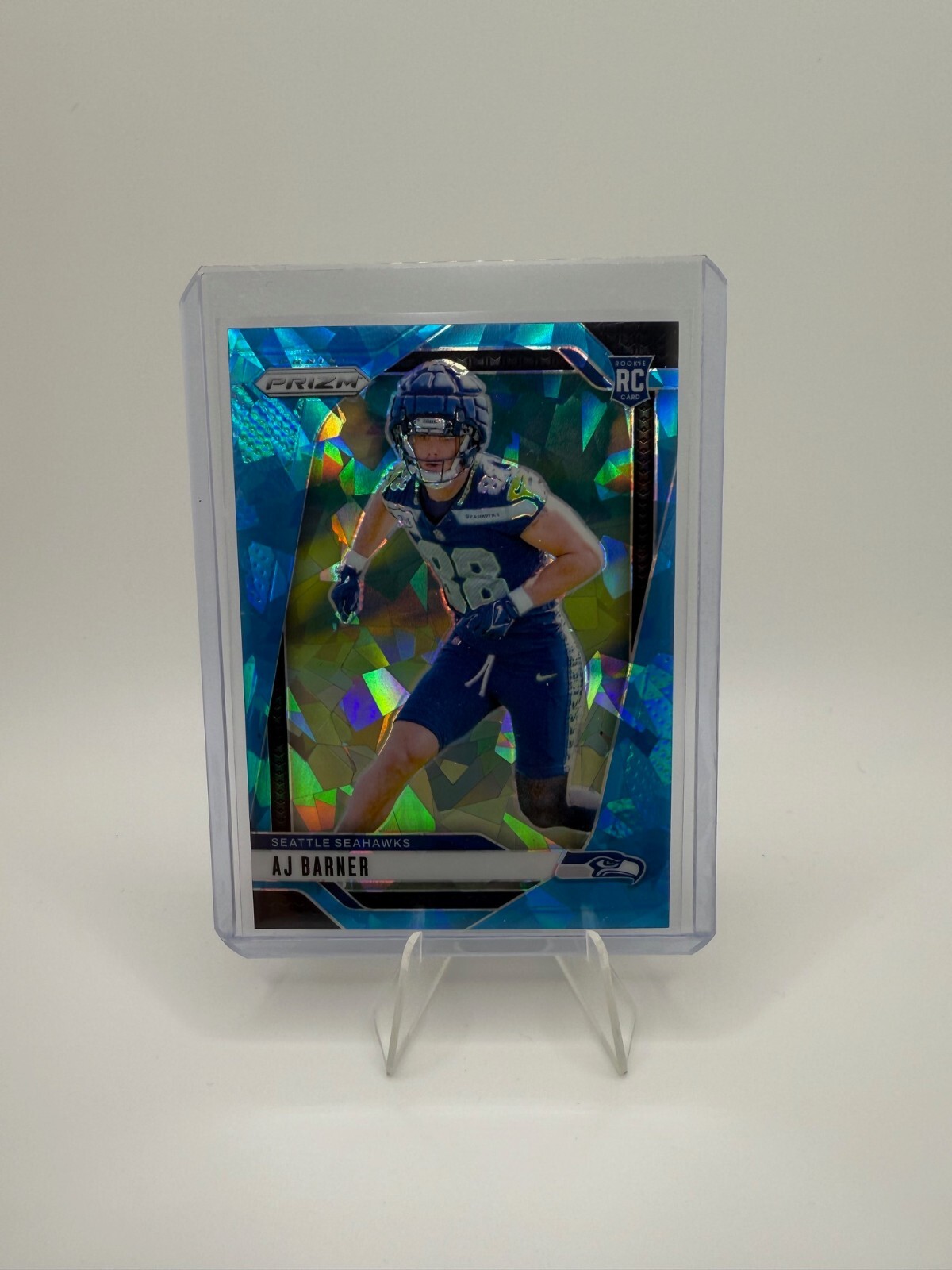 2024 Panini Prizm AJ Barner Rookie RC Blue Ice Prizm /99 Seahawks