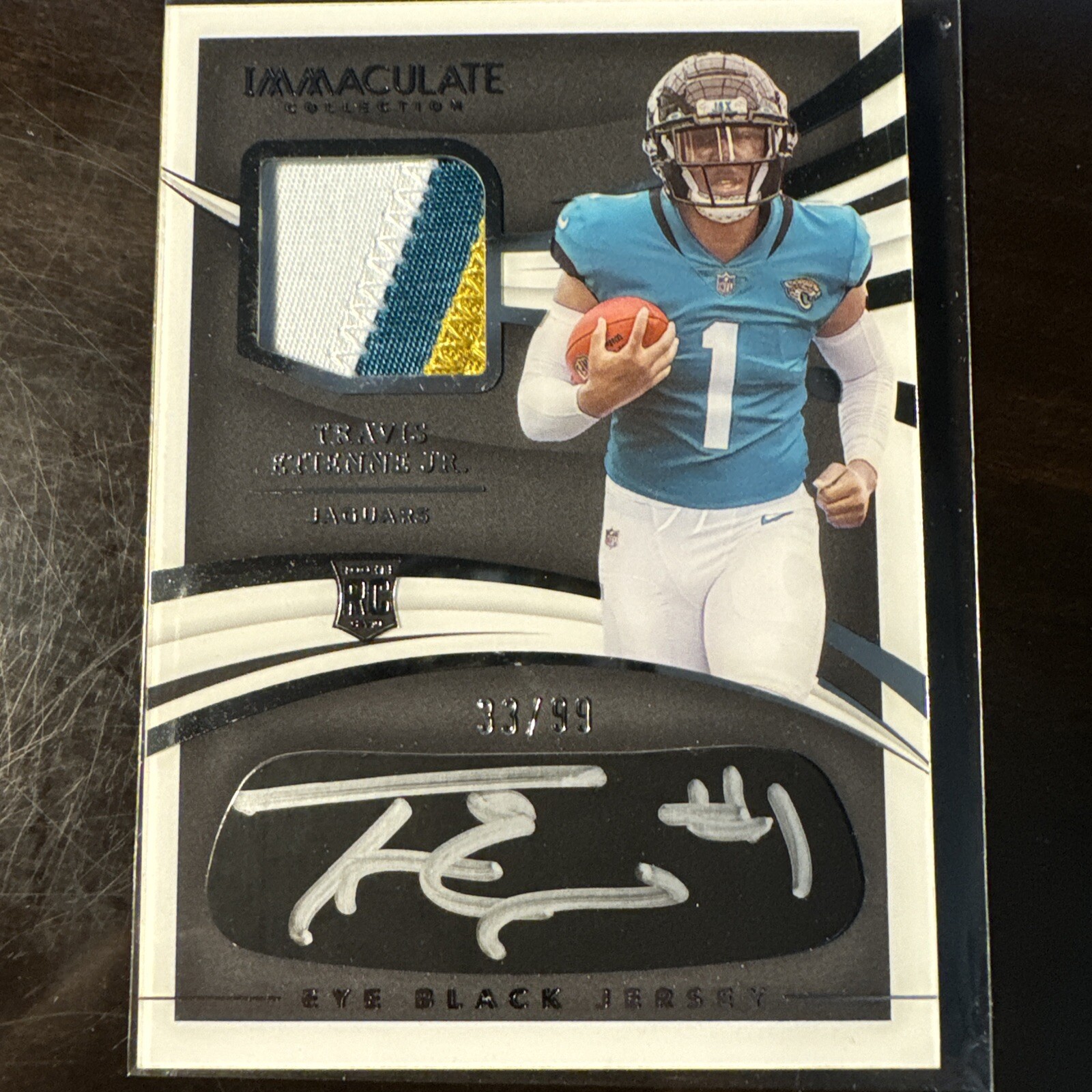 2021 Panini Immaculate - Eye Black Jersey #REB-TE Travis Etienne /99 AU, MEM, RC