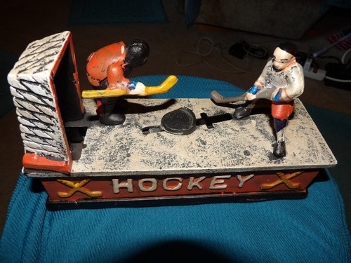 vtg cast iron mechanical hockey coin bank