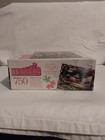 White box of Roseart Borders 750-piece puzzle featuring colorful floral and landscape design with “Made in U.S.A.” text.