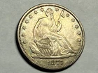 1877 SEATED LIBERTY silver U.S. half dollar. XF-AU, some luster. #q1