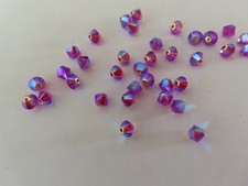 36 Swarovski Bicone Beads 4mm Fuchsia AB 2x. 5328