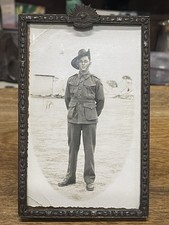 WWII RPPC Soldier In Pressed Metal Frame With Rising Sun Emblem At Top - unknown