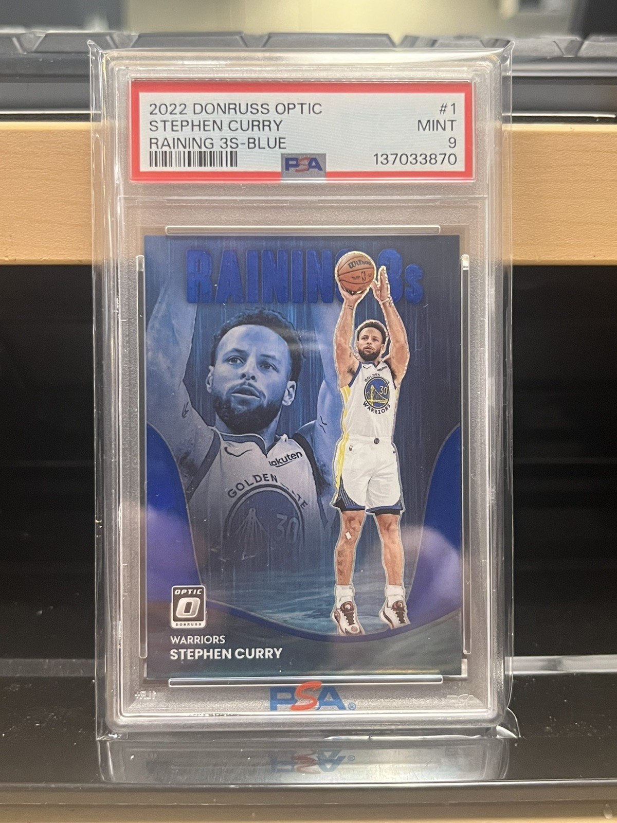 2022-23 Panini Donruss Optic Stephen Curry #1 Raining 3s Blue /49 PSA 9