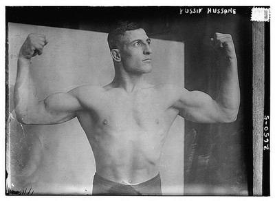 Photo:Yussif Hussane 1910s Bodybuilder Flexing Posed Portrait
