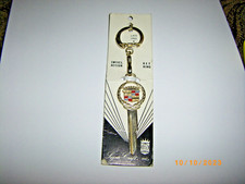 CADILLAC GOLD KEY UNCUT NOS 1960s AND UP WREATH CREST EMBLEM CADILLAC NECKLACE