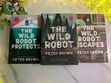 The Wild Robot Series: The Wild Robot Protects Escapes by Peter Brown Paperback