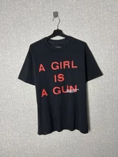 PLEASURES x Feminine Product “A Girl Is A Gun” Big Logo Tee Size M