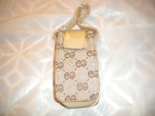 NEW BEIGE  CELL PHONE POUCH WITH DESIGN AND A  STRAP FOR THE PURSE