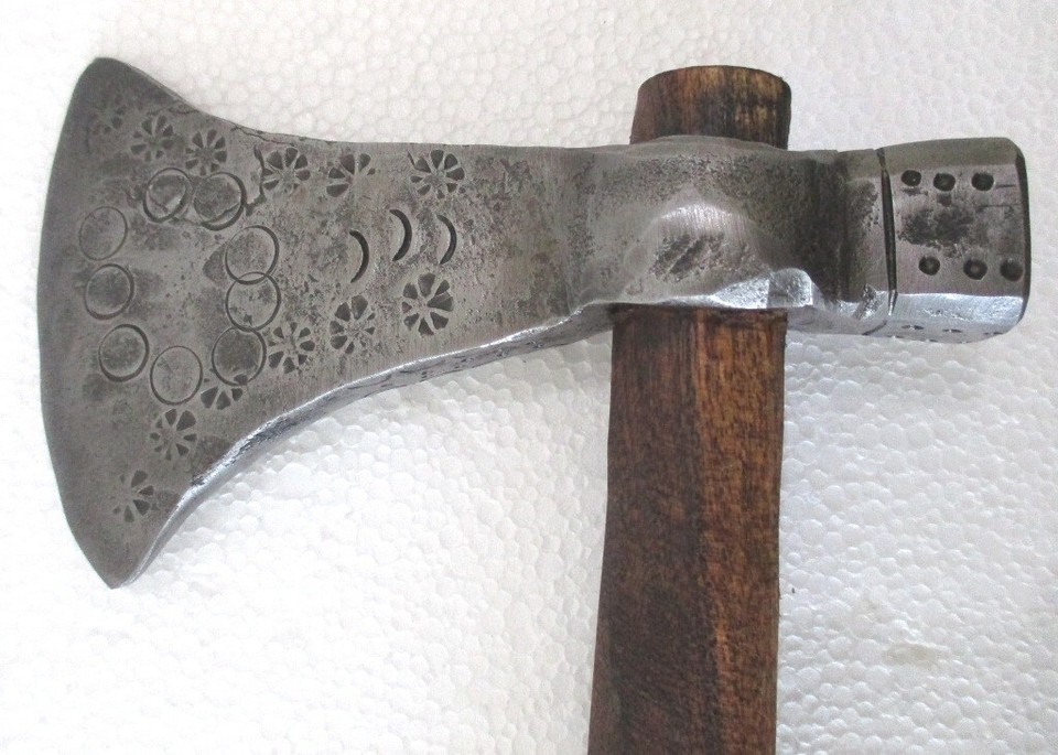 A finely crafted antique axe-hammer with genuinely beautiful design lines — the kind of hand-forged piece you'd frame rather than use.