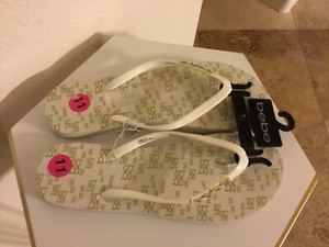 bebe gold flip flops