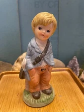 Bisque Figurine Little Blond Boy - Shiny Eyes- Delivering Papers  ~5" H x 2" W