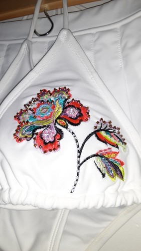 two piece women's bathing suit, white, pleated, skirt style bottom, flower top - Picture 2 of 4