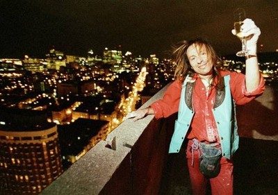 French climber Alain Robert celebrates with a glass of champagne 2- Old Photo