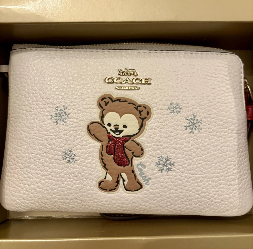 Muñequera/cartera Coach en caja con cremallera con motivo de copo de nieve de oso y dijes nueva Foto 3 de 4