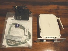 MODEM-ROUTER NETGEAR DG83G v3+WG111v2, 2 CD-ROM DRIVER E MANUALS + AC/DC ADAPTER