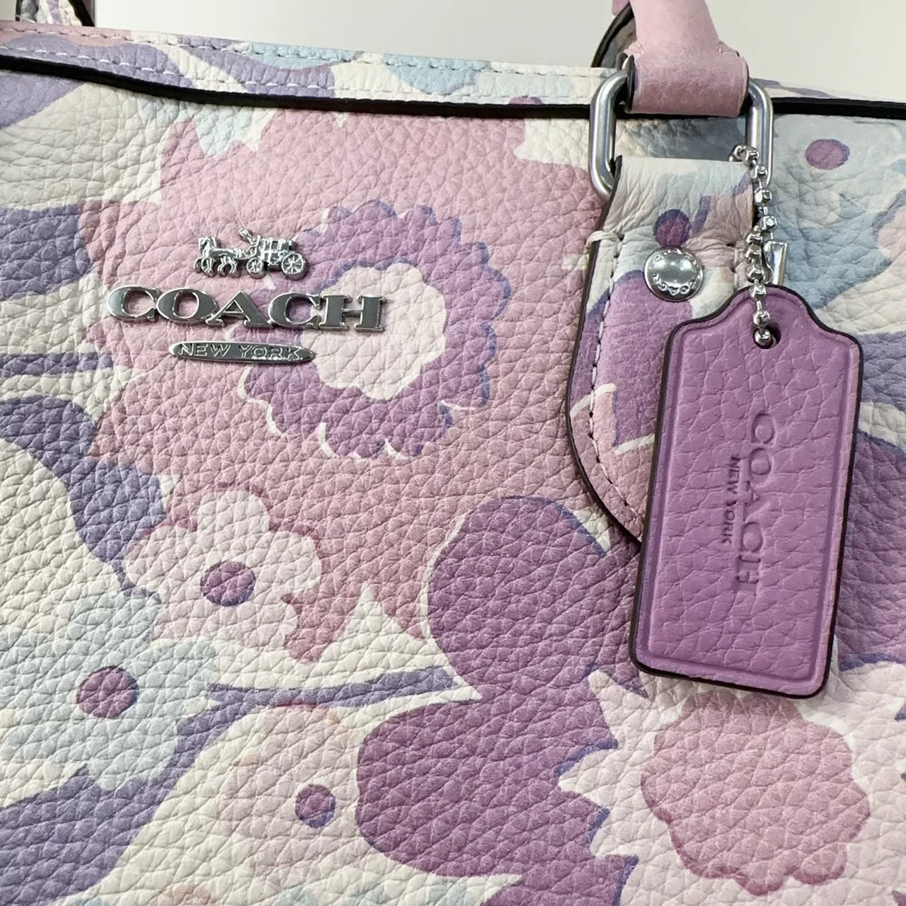 Borsa a tracolla Coach Rowan nuova con etichetta con stampa floreale in argento avorio multi viola CBG82
