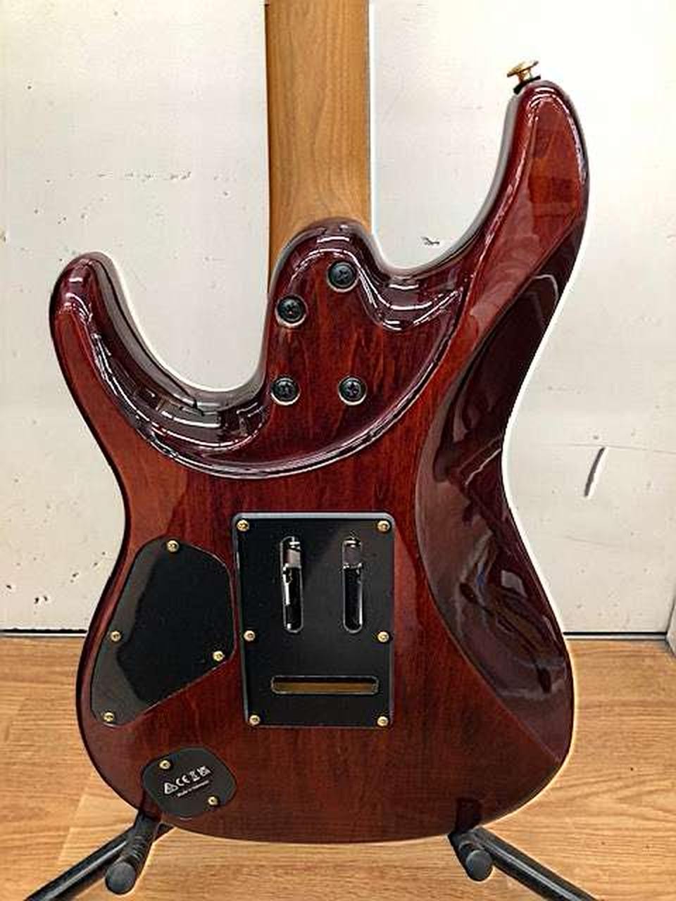 Ibanez AZ47P2K Dragoneyeburst used electric guitar with glossy finish, silver hardware, and black pickguard on stand.