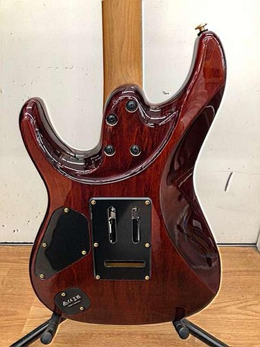 Ibanez AZ47P2K Dragoneyeburst used electric guitar with glossy finish, silver hardware, and black pickguard on stand.