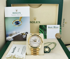 ROLEX 18kt Gold Day Date 40 President Silver Index Motif Model 228238