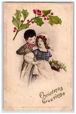 1911 Christmas Greetings Girl And Boy Flowers Holly Berries Antique Postcard