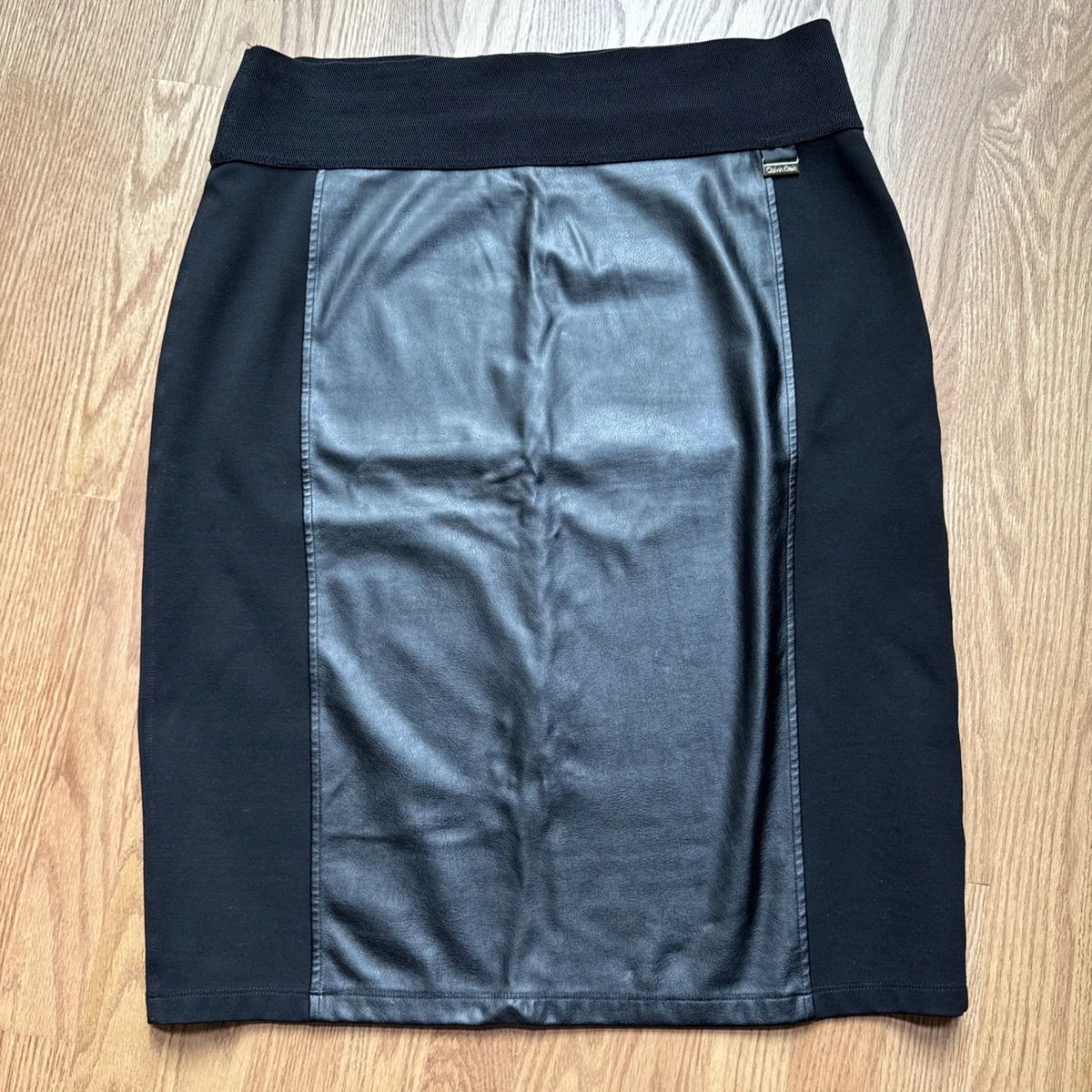chinese dress ladies BCBGeneration Women's A Line Faux Leather Lace Up Mini Skirt, Onyx, X-Small  at Amazon Women's Clothing store