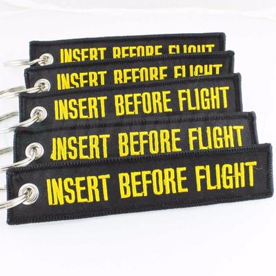 INSERT BEFORE FLIGHT QTY= 5 PCS BLACK/yellow KEYCHAIN RING TAGS CABIN CREW