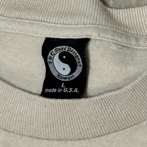 Tan collar Y2K VTG T&C surf shirt with black circular logo, “Made in U.S.A.” text, and wave design on front.