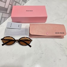 Miu Miu Women  s 04ZS Oval Sunglasses Brown Frame  Tinted Brown Lenses Plastic