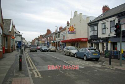 PHOTO  QUEEN STREET WITHERNSEA SEEN HERE FROM THE JUNCTION WITH STATION ROAD WIT